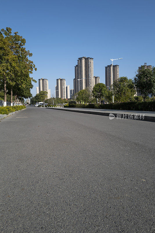 city ​​buildings beside asphalt road